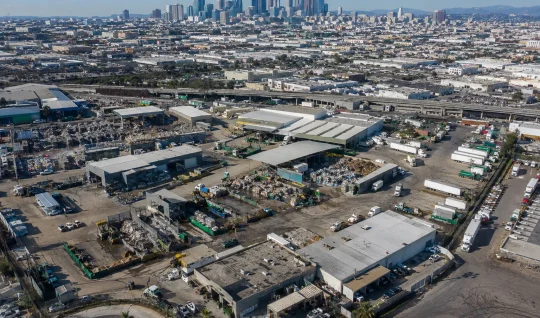 Use Case Card 1 Aerial view of a city with an industrial diversion district, representing city-wide waste diversion systems.