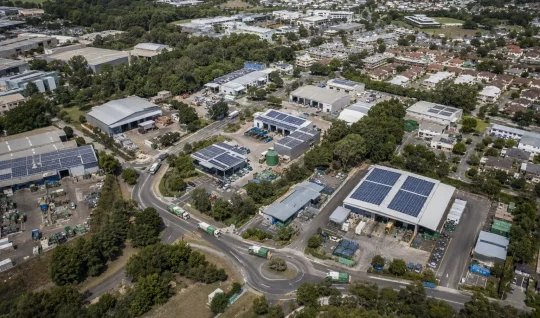 Use Case Card 1 Aerial view of an urban and regional area with distributed waste processing hubs.